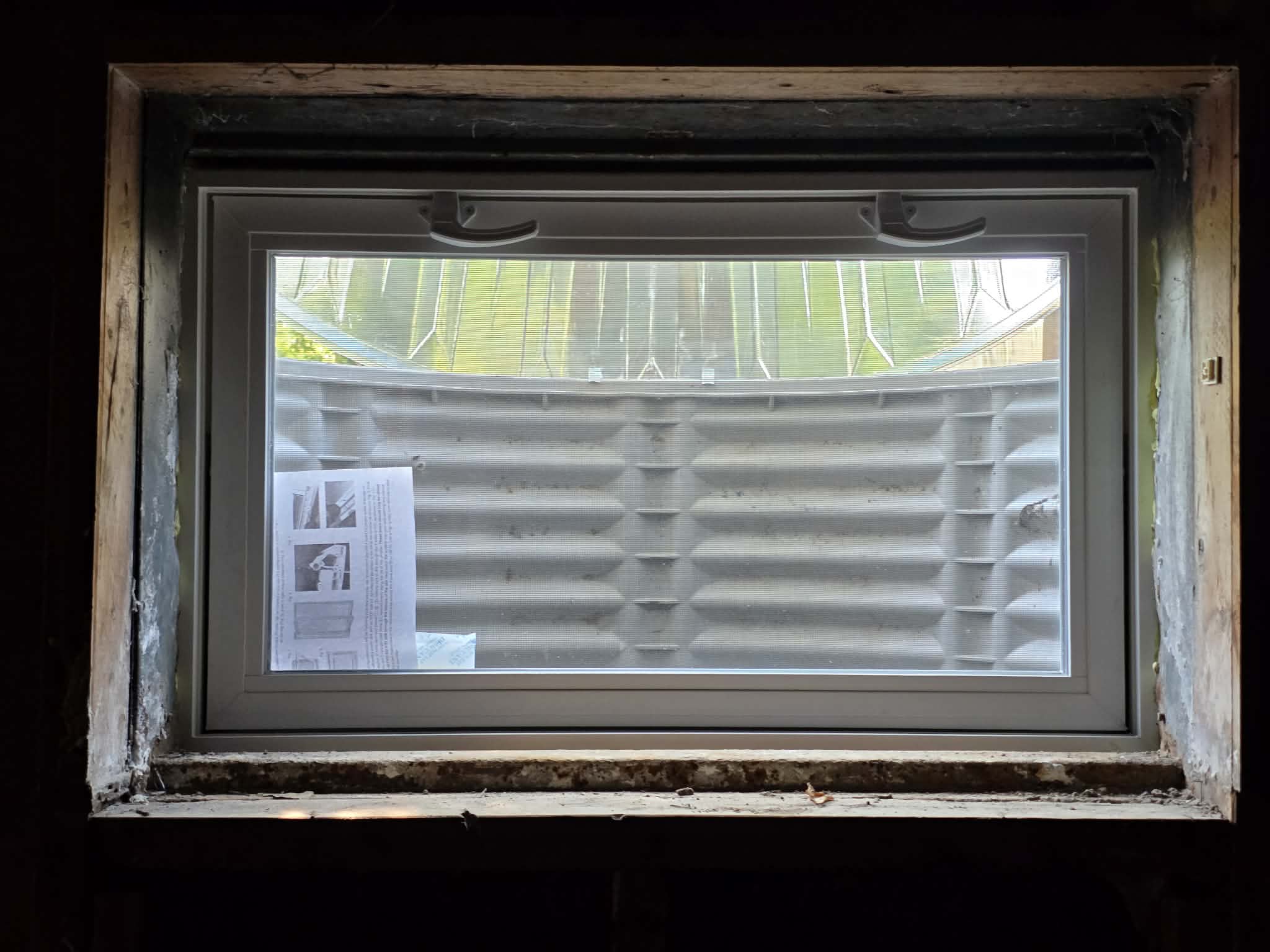 Window installations with wells, caps, and grading β photo 3