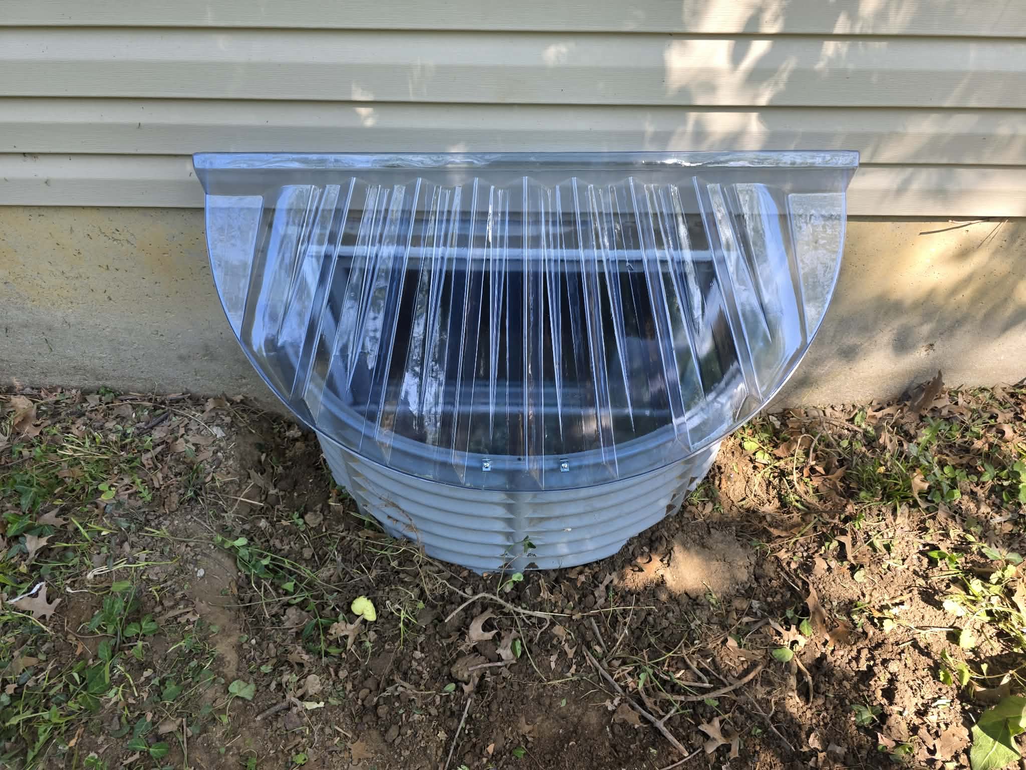 Window installations with wells, caps, and grading β photo 5