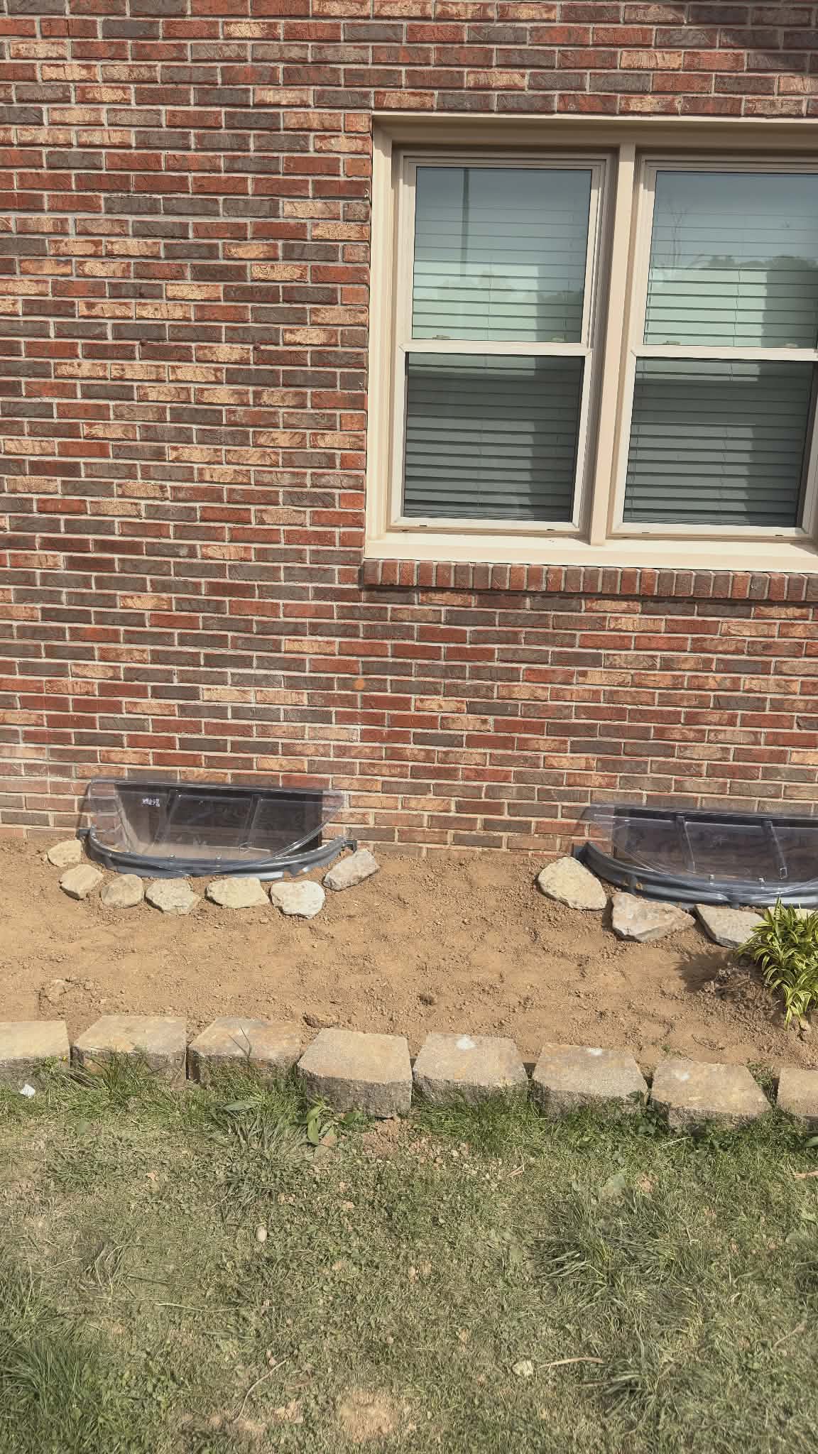 Window installations with wells, caps, and grading β photo 6