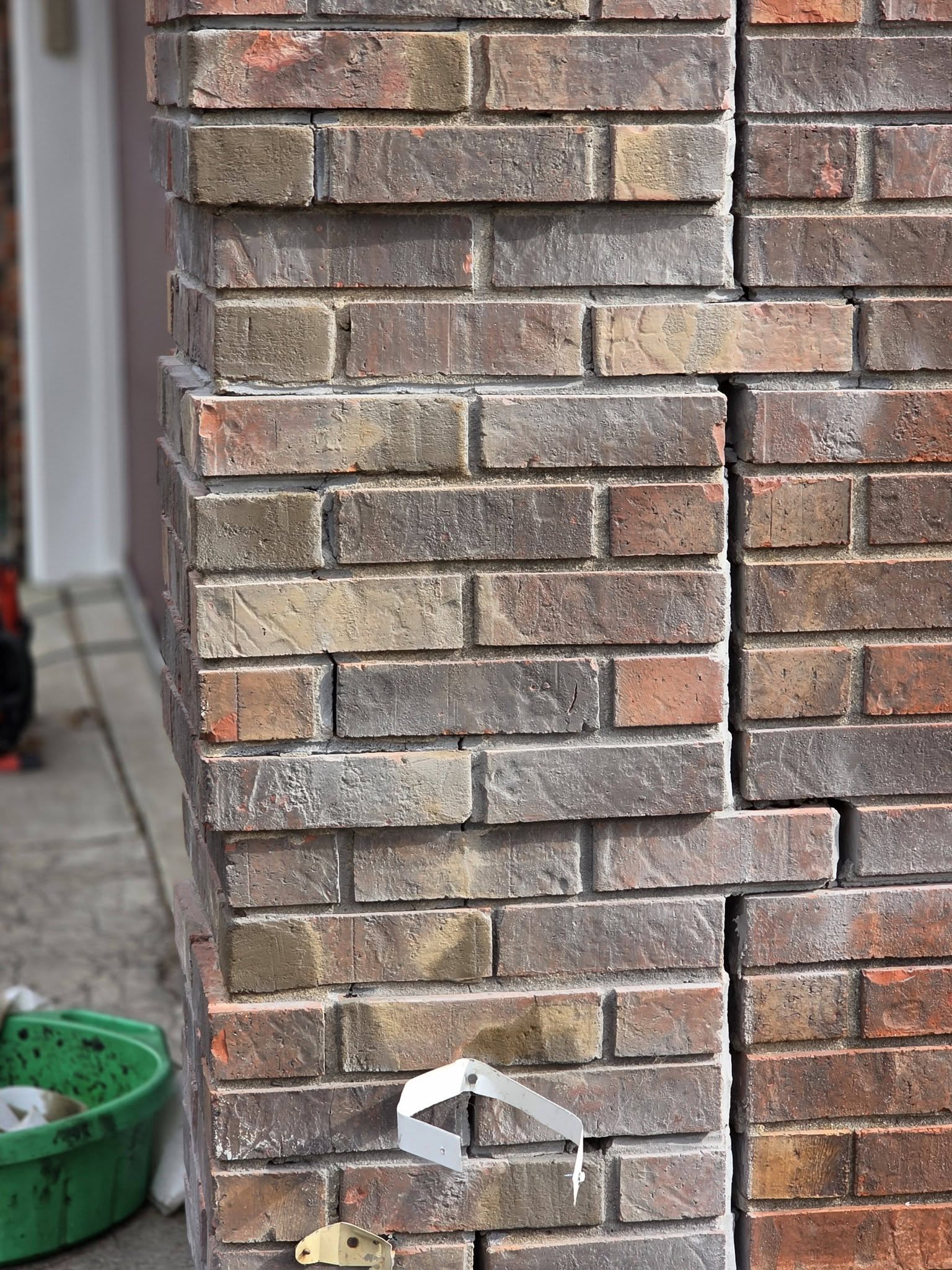 New brick course tied into existing wall
